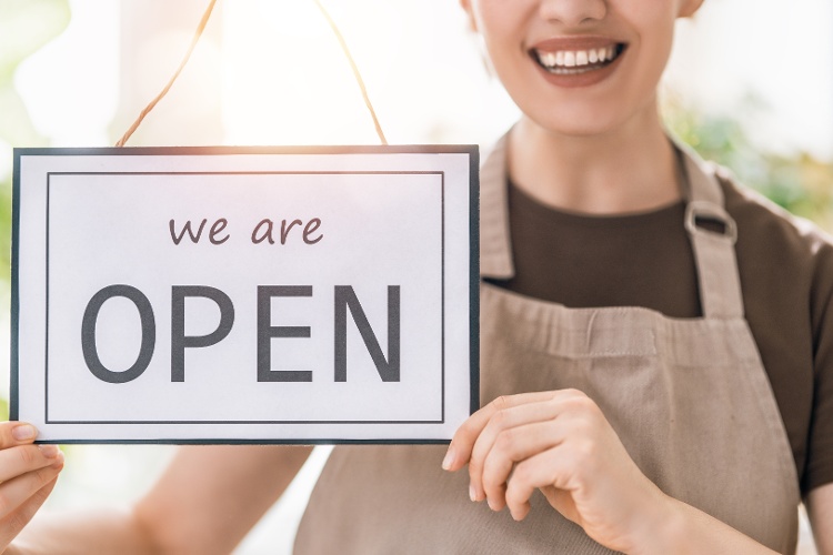 business-owner-holding-the-sign-for-the-reopening-2021-08-28-09-23-29-utc-1