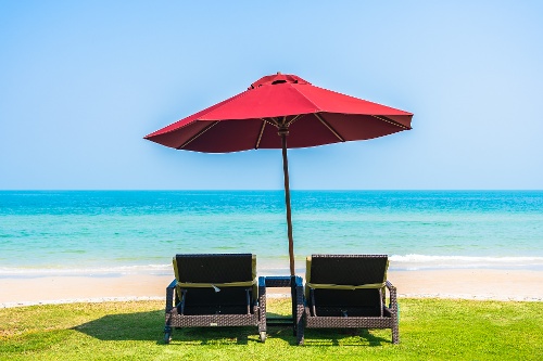 empty-deck-chair-lounge-with-umbrella-around-on-be-2022-12-16-03-50-34-utc-1