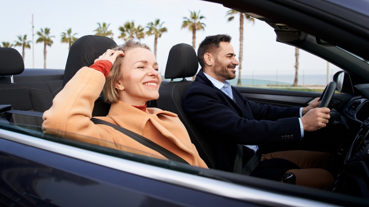 happy-mature-couple-having-fun-driving-on-converti-2023-10-04-01-45-21-utc-3