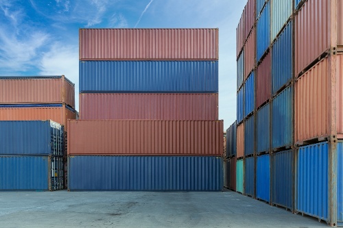 stack-of-containers-in-a-harbor-shipping-containe-2022-11-16-14-01-53-utc-1