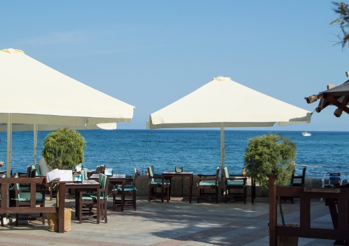 tables-and-umbrellas-at-the-seaside-restaurant-on-2023-06-26-22-13-15-utc-1